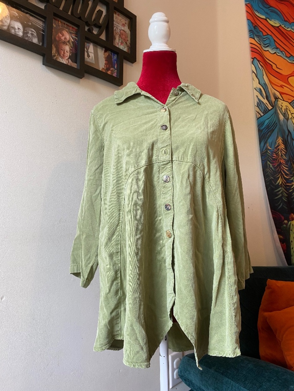 long-sleeve button-down top features a unique lagenlook-inspired flared hem